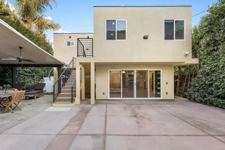 Modern luxury living room interior with contemporary art and large windows at 1500 block on Rexford Drive.