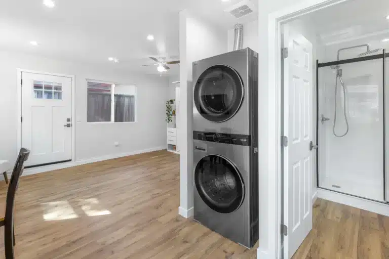 Modern laundry space in Los Angeles ADU garage conversion with LG stacked washer and dryer