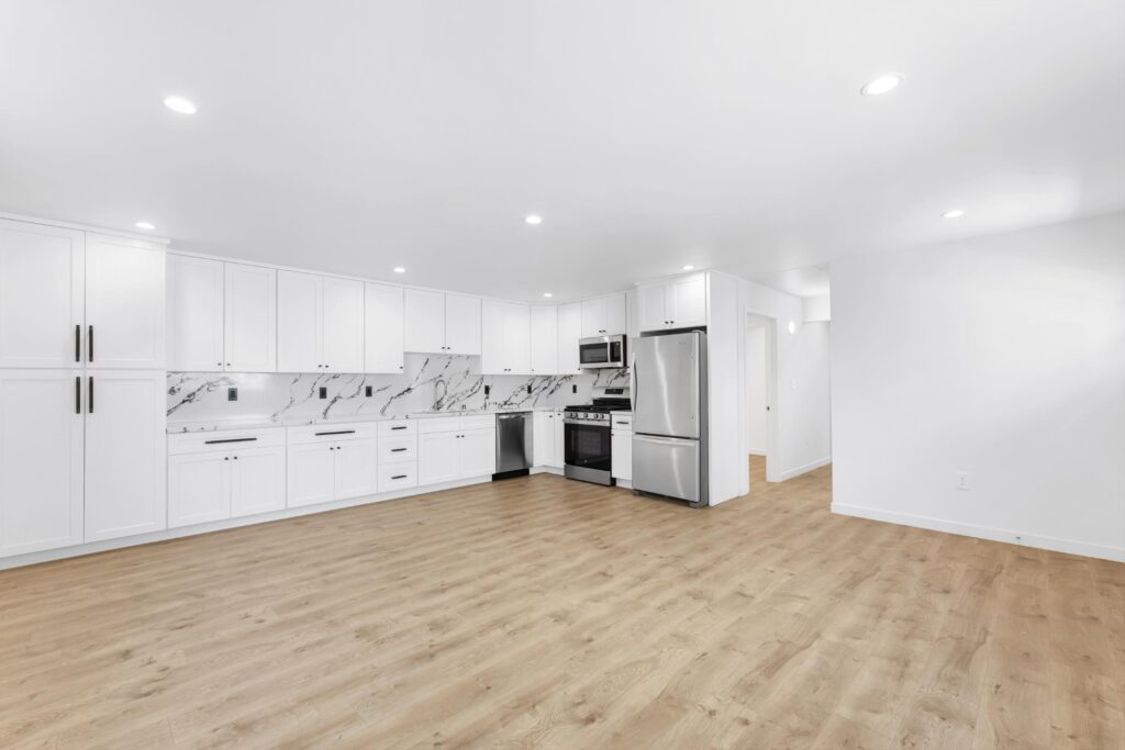 Los Angeles ADU Builder project featuring a modern kitchen with white cabinets, stainless steel appliances, and open floor plan by ME Development Inc.